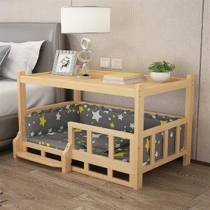 Elevated Solid Wood Pet Cot Next to Bed With Lamp and Other Items On Top