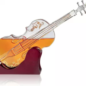 Half Filled Glass Violin Decanter Against White Background