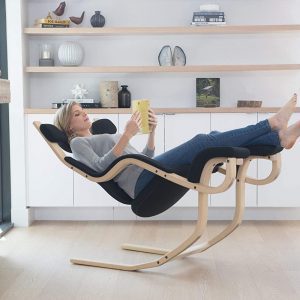 Woman Rocking In Varier Gravity Balans Recliner and Kneeling Chair