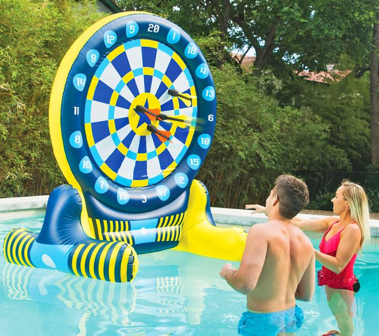 Couple Playing on the Giant Inflatable Pool Dart Board In A Pool