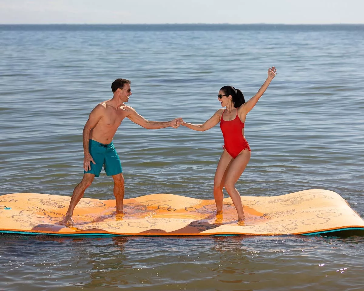 Man and Woman Dancing on Giant Water Mat