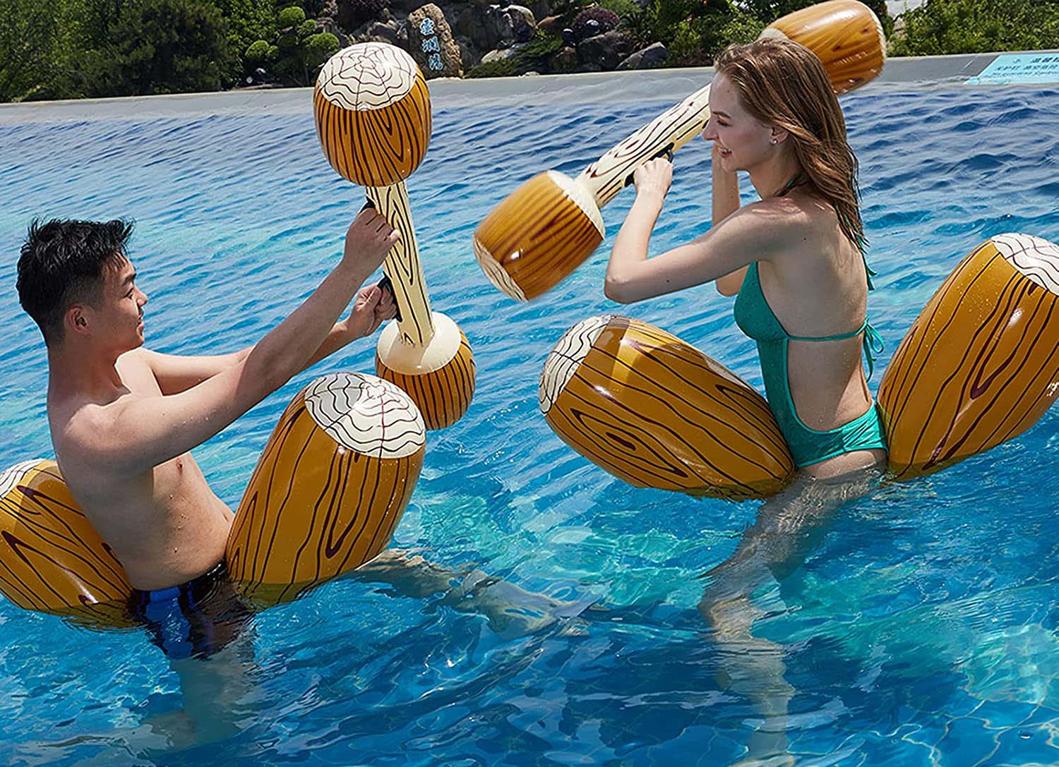 Two Teens Using Pool Floats Battle Log Rafts