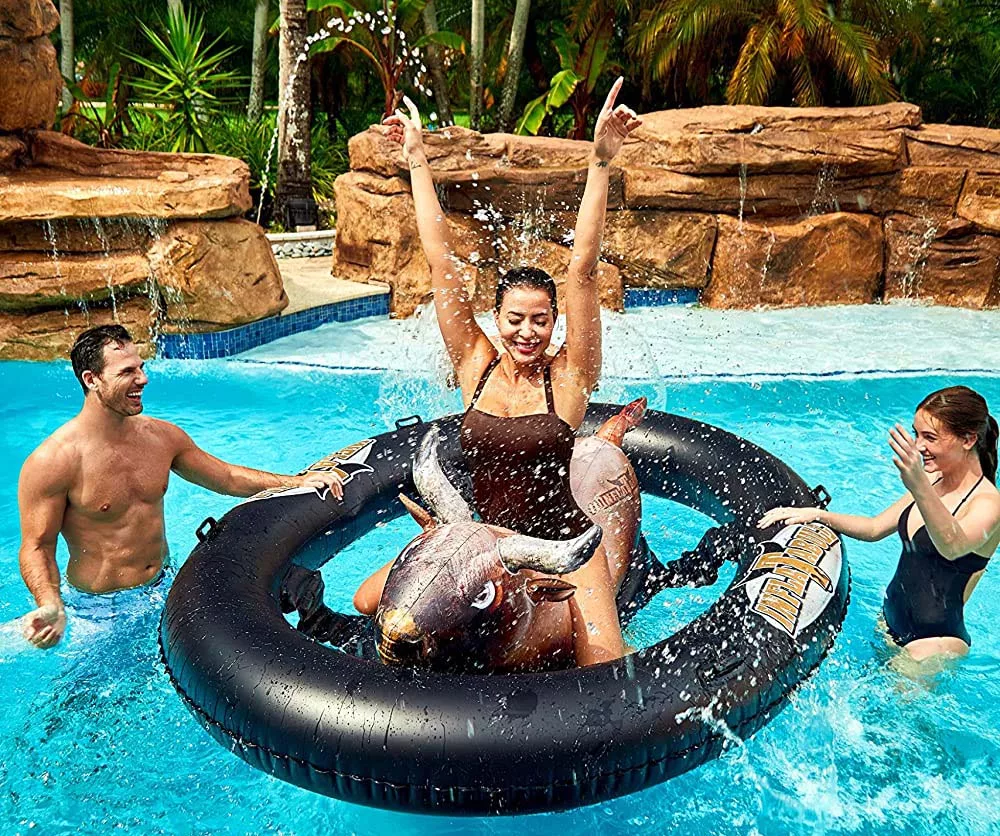 Woman Riding on the Inflatable Bull Riding Pool Toy
