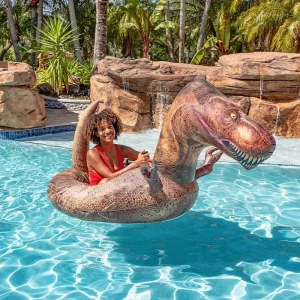 Woman Sitting In Motorized Inflatable Gigantic Dinosaur Ride-on