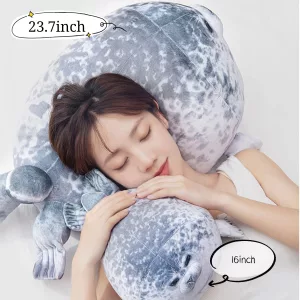 Woman sleeping with two Large Seal Plush Pillow sizes