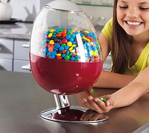 Young Girl Using Motion Activated Candy Dispenser