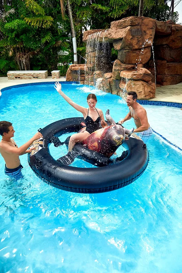 Family In Pool Using the Inflatable Bull Riding Pool Toy