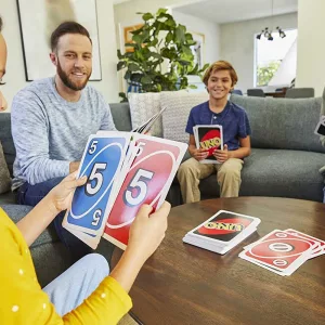 Family Playing with UNO Giant Sized Card Game
