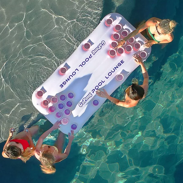 Group Playing on Inflatable Floating Beer Pong Table Overhead Shot