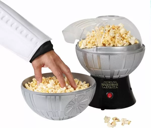Hand Picking Popcorn Out of Star Wars Death Star Popcorn Maker