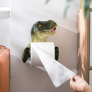 Hand Pulling Toilet Paper from Dinosaur Toilet Paper Holder