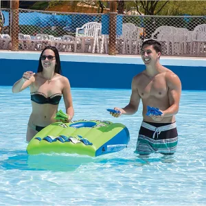 Man and Woman Playing with Floating Cornhold Set in Pool