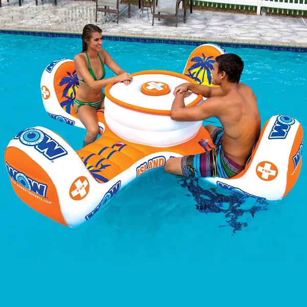 Man and woman sitting across from each other on Floating 4-Person Table in a pool