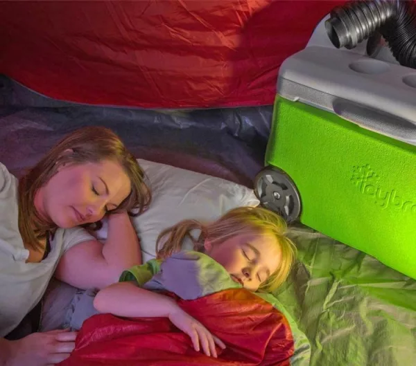 Mother and daughter sleeping with IcyBreeze Portable Air Conditioner and Cooler