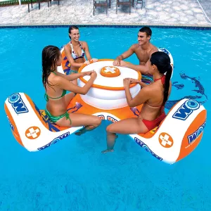 Three women and a man sitting on Floating 4-Person Table In Pool