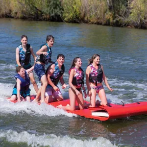 Two Women and Four Men on Tow Boggan 6 Person Towable Watermat Riding on the Lake