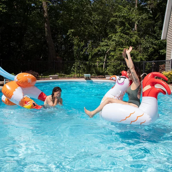 Two women fighting in pool on Chicken Fight Pool Toys