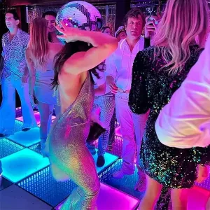 Woman In Night Club Wearing the Disco Ball Helmet