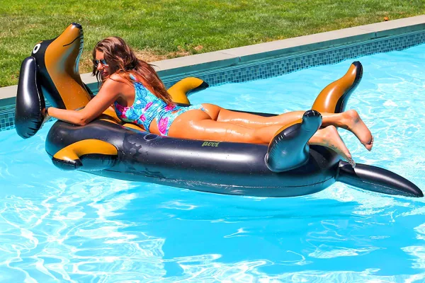 Woman Laying On Giant Wiener Dog Pool Floats