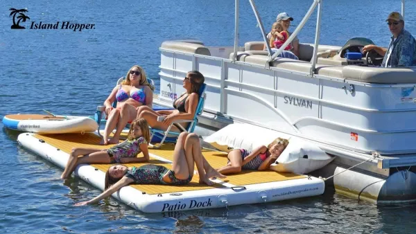 Woman Laying on Inflatable Patio Deck Next to Boat