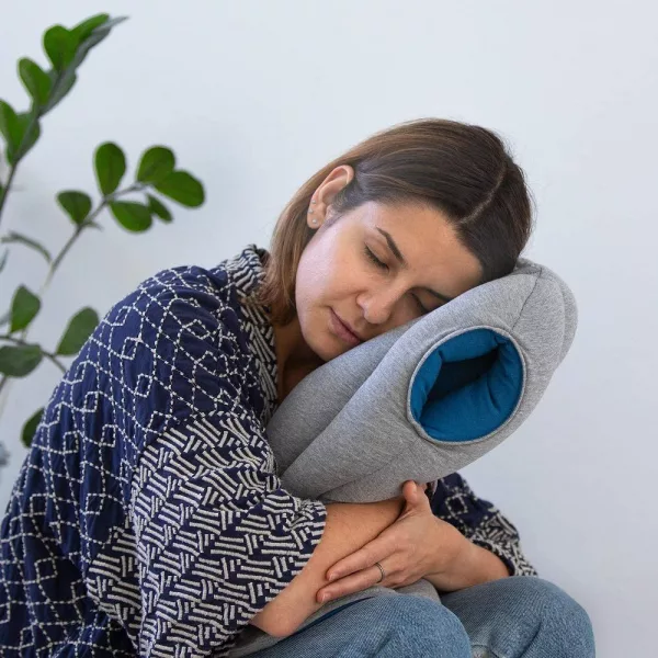 Woman Napping On Ostrich Portable Nap Pillow