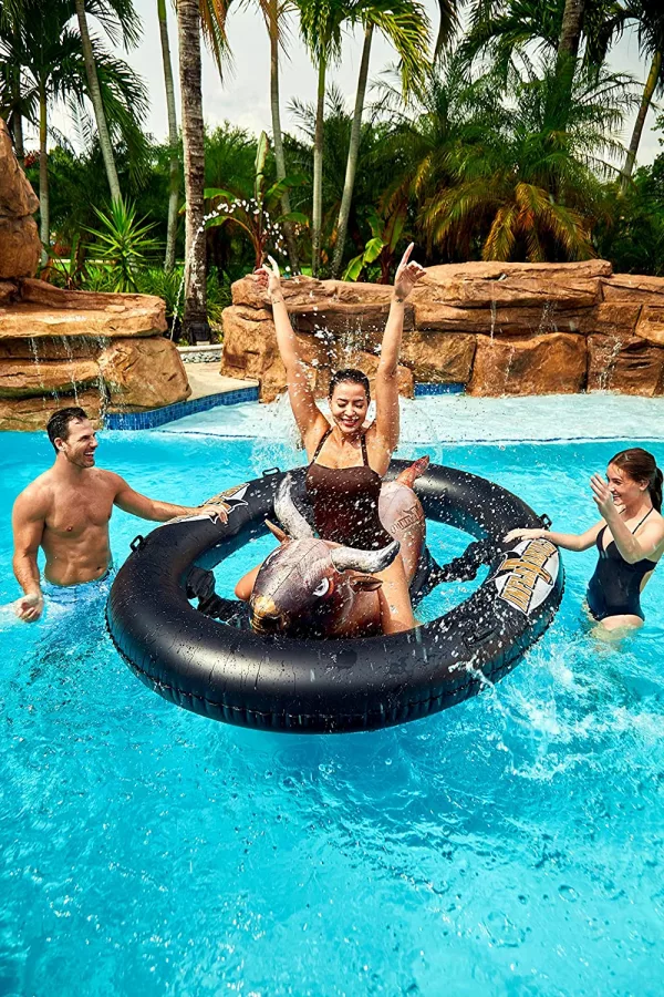 Woman Riding on the Inflatable Bull Riding Pool Toy
