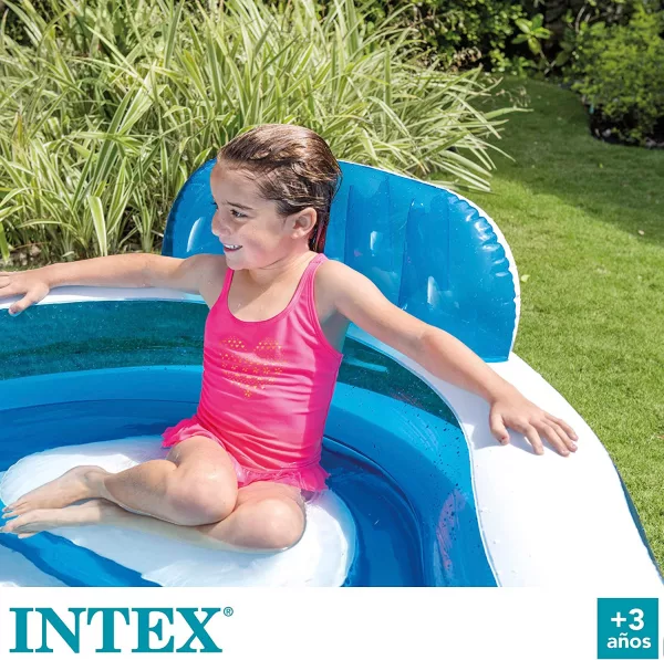 Young Girl Sitting In Inflatable Lounge Chair Pool