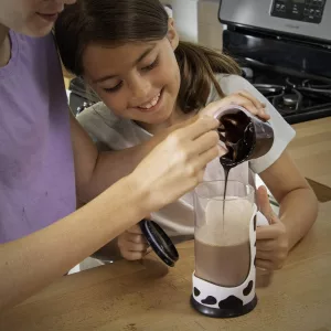 Young Girl Using Moo Mixer Chocolate Milk Mixing Cup