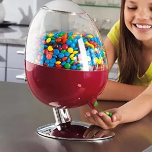 Young Girl Using Motion Activated Candy Dispenser