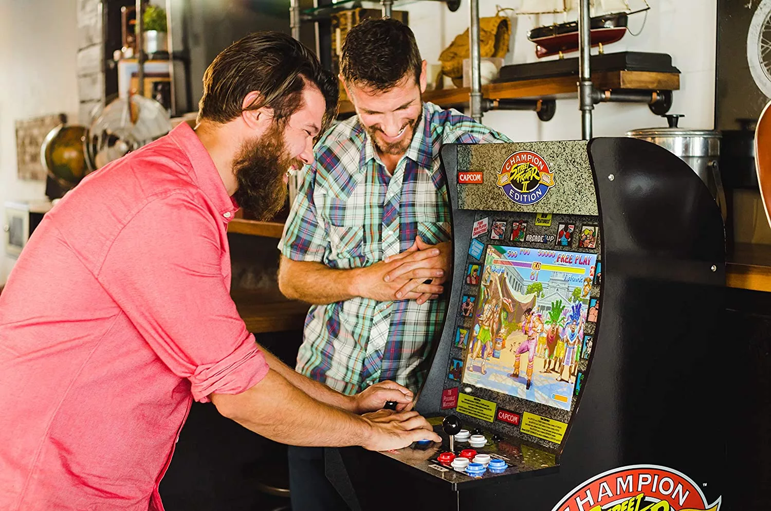 Two guys playing on the Mini 4 Foot Retro Arcade Machine in an office