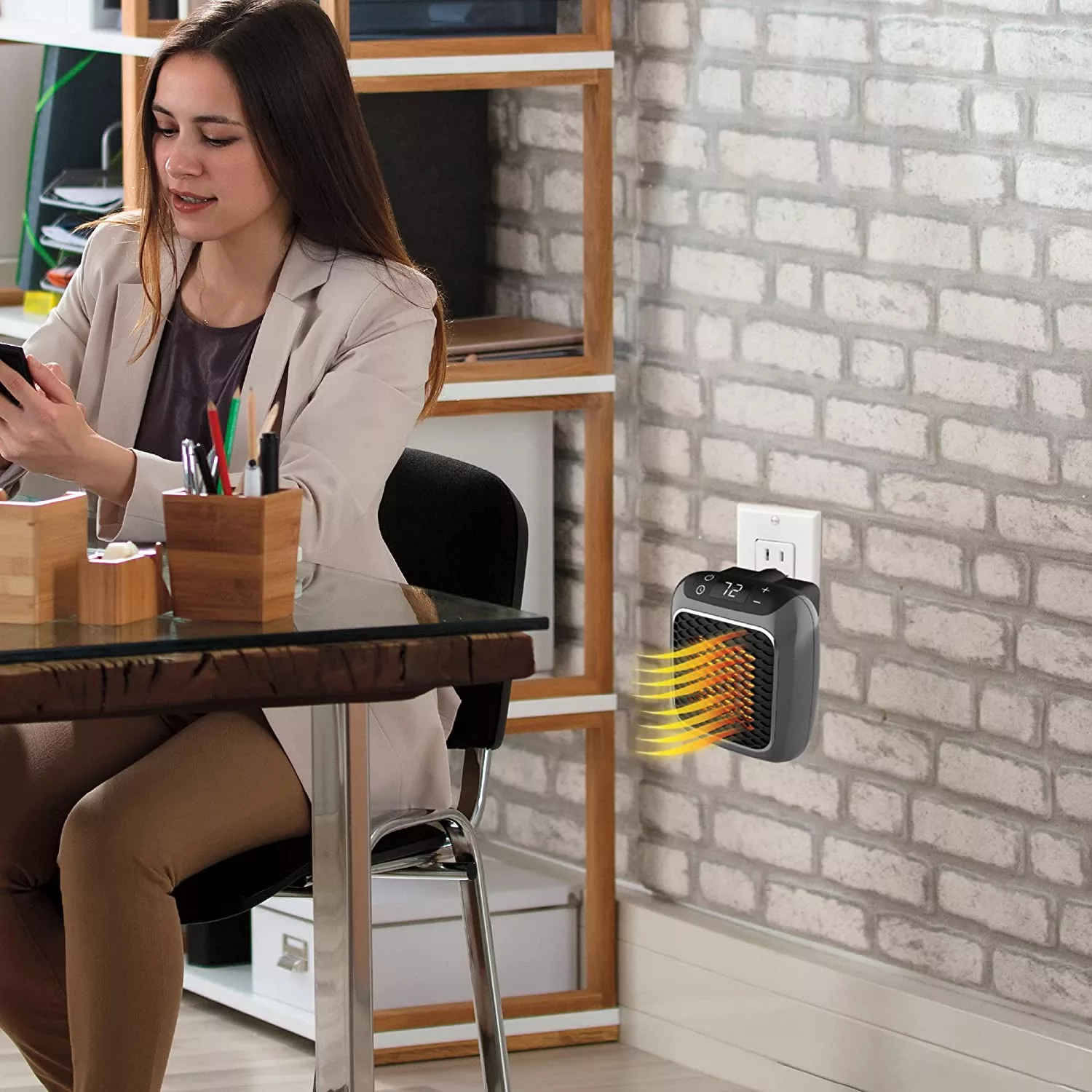 Woman sitting at desk with Ontel Handy Heater behind her