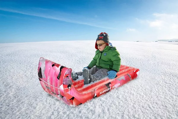 Young Child On the Flexible Toboggan Sled